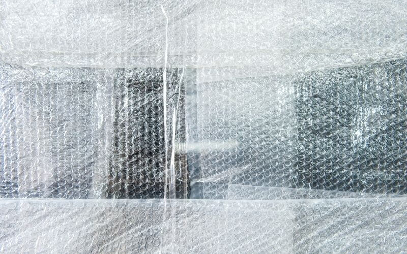patches of bubble wrap on a window.